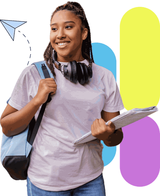 A smiling learner holding her workbooks